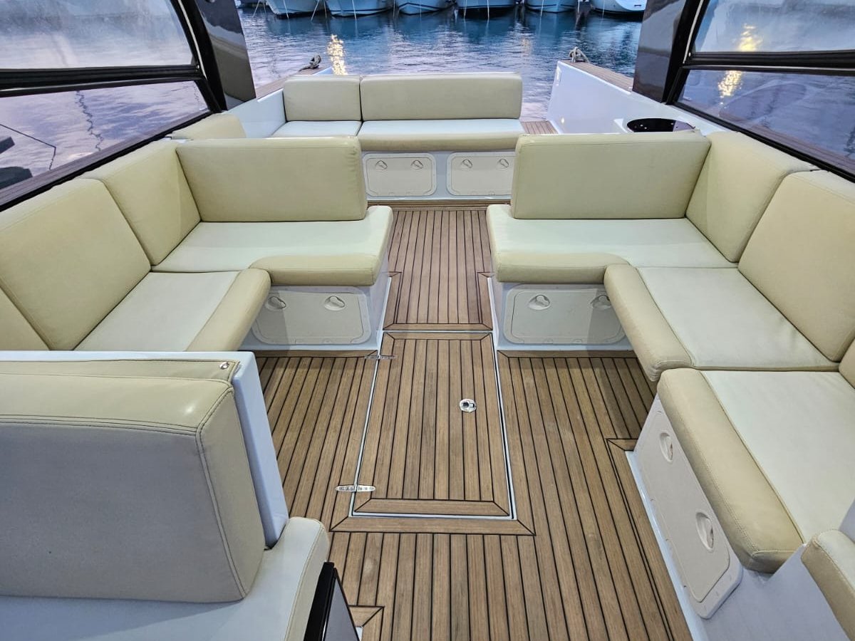 Aft lounge seating on a teak deck at Split marina