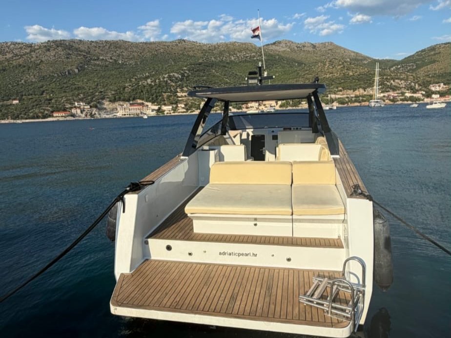 Teak swim platform of a private boat docked in Split