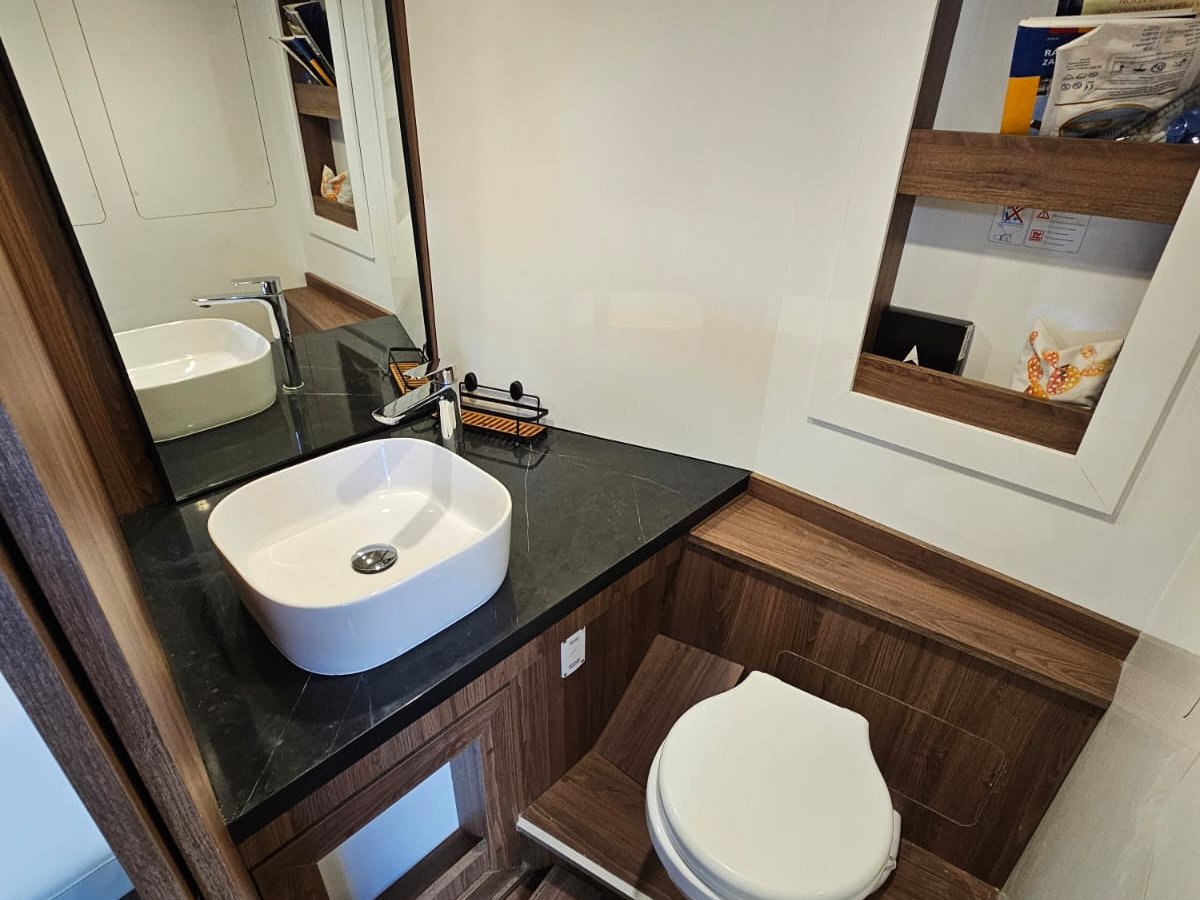 Cabin head bathroom interior aboard a Blue Cave tour boat