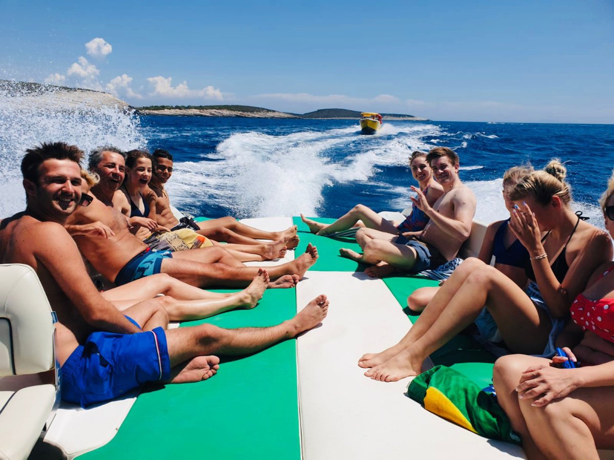 Group relaxing on the Enzo 35 stern sunbed on a Blue Cave tour