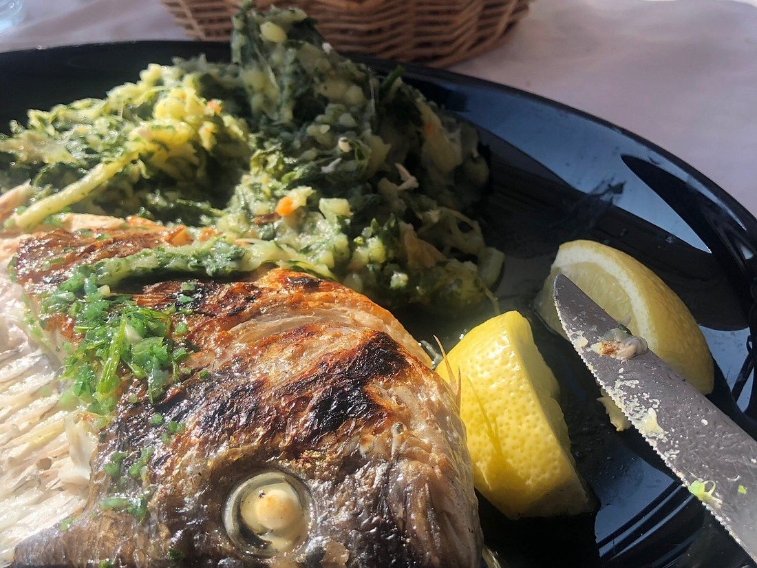 Whole grilled fish with Swiss chard and potatoes in Milna on Hvar