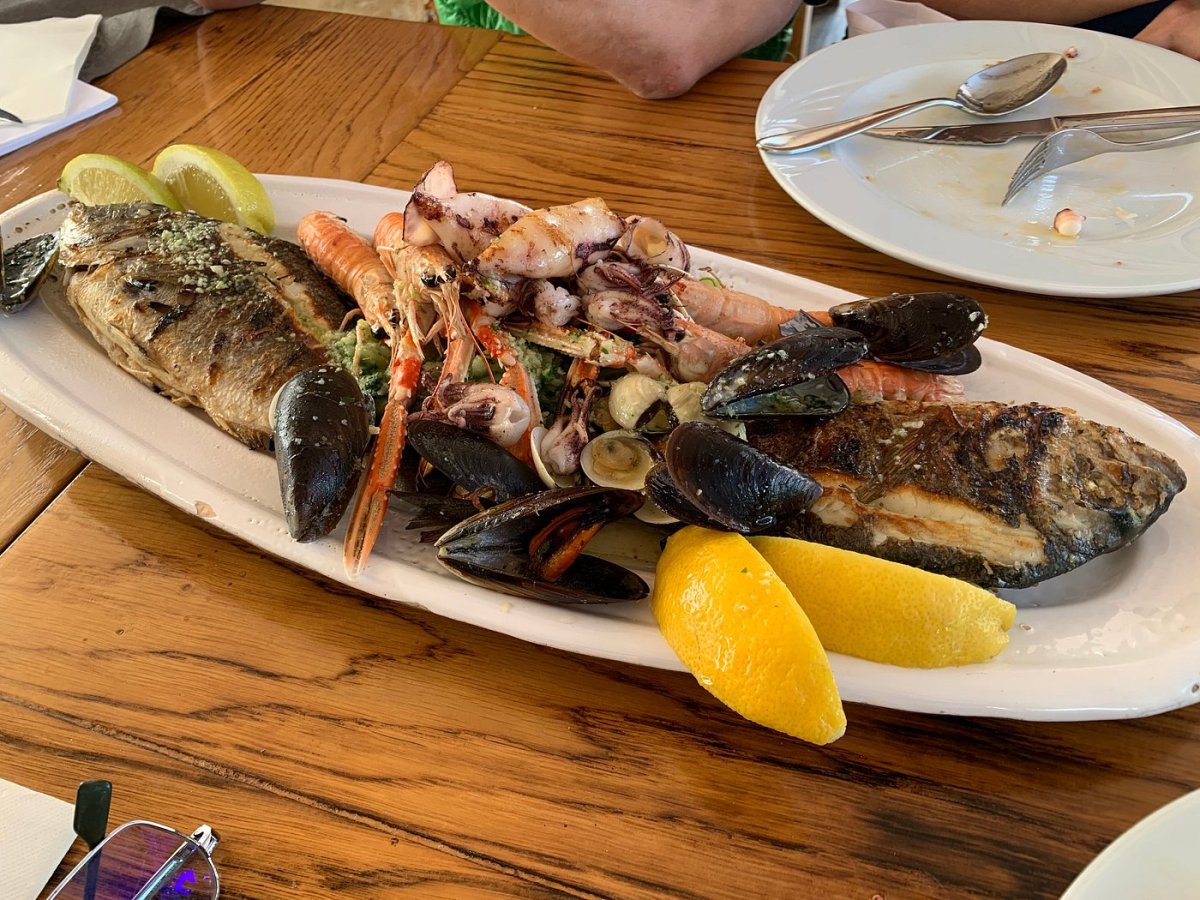 Grilled seafood platter with fish, scampi and mussels in Milna